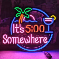 Round It's 5:00 Somewhere neon sign with palm tree and cocktail, color option 2 shown close up on a pink wall