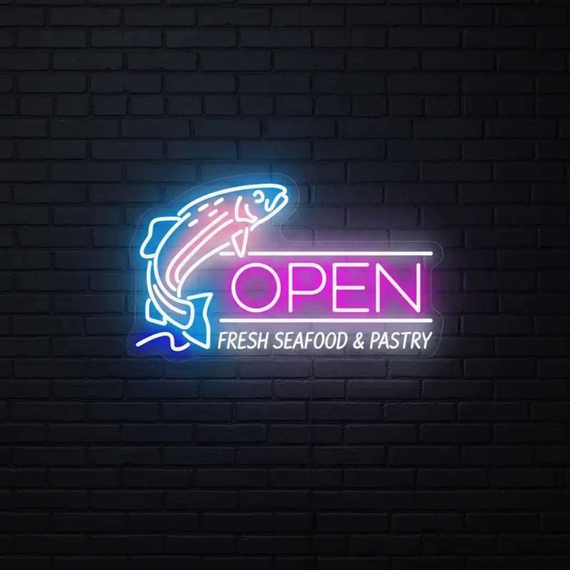 Fish Open neon sign with jumping fish and Fresh Seafood and Pastry text on a dark brick wall