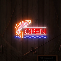 Fish Open neon sign with jumping fish glowing orange and red on a wood wall